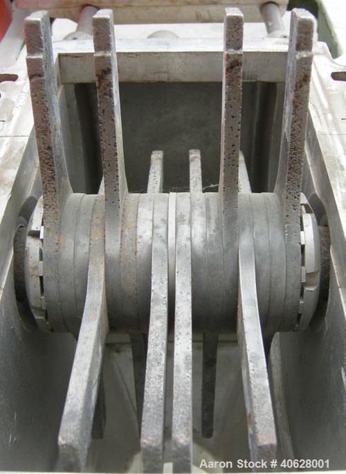 Used Fitzpatrick Fitzmill, Model DASO6, 316 stainless steel. 16 fixed double impact 410 stainless steel blades. 6" x 11" cutting chamber, gravity feed throat with a 2 7/8" tri clamp opening, no botto...