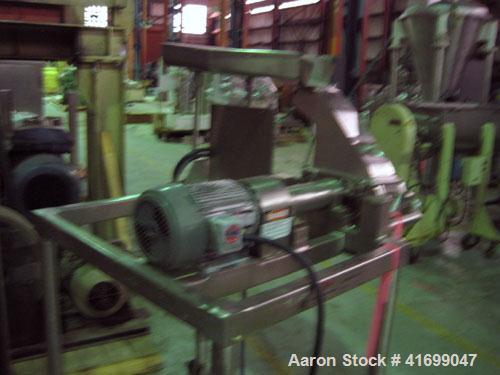 Used Fitzpatrick Fitzmill, modelD6A, stainless steel. Pan feed, fixed blades. Driven by a 5 hp, 230/460 volt motor. Mounted on a stainless steel base with casters.