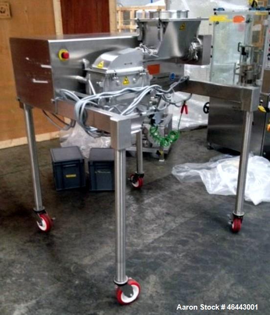 Used Fitzpatrick Fitzmill, Model D6A. Stainless steel construction, cantilivered design with screw feeder with feed hopper, driven by .37 kw, 230/400 volt, 1430 rpm motor, on stainless steel base wit...