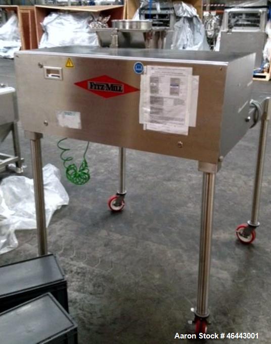 Used Fitzpatrick Fitzmill, Model D6A. Stainless steel construction, cantilivered design with screw feeder with feed hopper, driven by .37 kw, 230/400 volt, 1430 rpm motor, on stainless steel base wit...