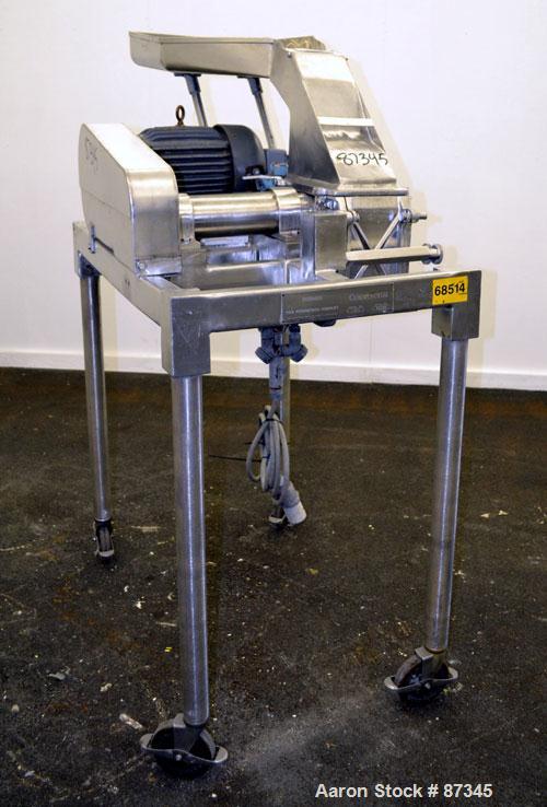 Used Fitzpatrick Fitzmill, Model D6A, 316 Stainless Steel. (16) Fixed knife/impact blades. 6" x 11" Cutting chamber, no bottom screen. Gravity feed throat with pan. Driven by a 5 hp, 3/60/230/460 vol...