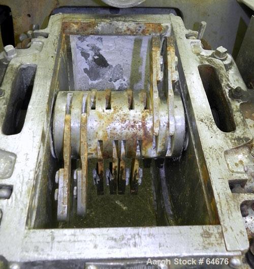 Used Fitzpatrick Fitzmill, Model D6, 316 Stainless Steel. 16 Double sided impact 410/16/20 stainless steel swinging blades, 6" x 11" cutting chamber, jacketed feed throat. 3" Diameter x 16" long scre...