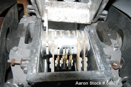 Used Fitzpatrick Fitzmill, Model D6, 316 Stainless Steel. 16 Double sided impact 410/16/20 stainless steel swinging blades, 6" x 11" cutting chamber, jacketed feed throat. 3" Diameter x 16" long scre...
