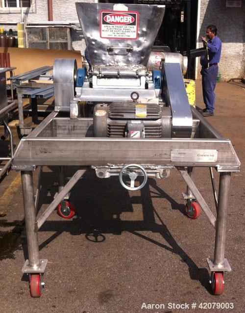 Used Fitzpatrick Fitzmill, Model DAS012, Stainless Steel.  Drop feed, 20 hp motor, mounted on stainless steel base.