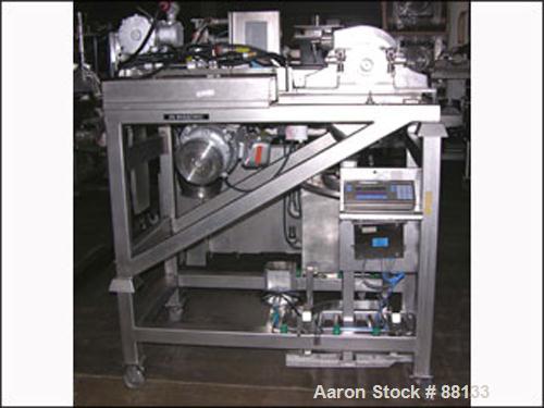 USED: Fitzmill, model DAS06, stainless steel. Fixed blades, screw fed top cover, driven by a 1/3 hp XP motor. Mill driven by a 10 hp, 230/460 volt motor. Mounted on a stainless steel frame. Includes ...