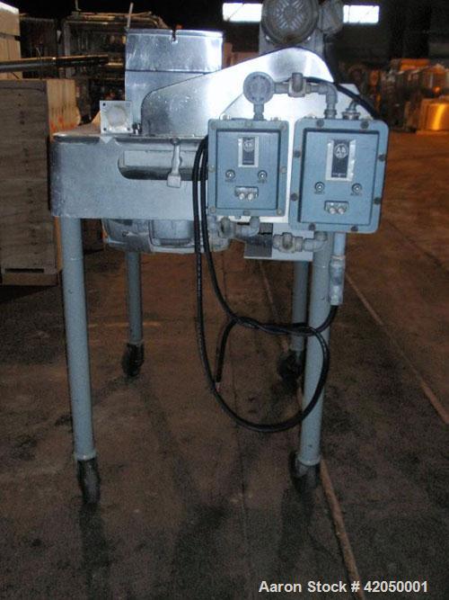 Used Fitzpatrick Fitzmill, Model DASO6, stainless steel. (16) Impact/knife fixed stainless steel blades, 11" x 13" cutting chamber. (1) Screw feed with hopper, driven by a 1/2 hp motor. Jacket feed t...