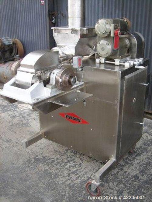 Used Fitzpatrick Fitzmill, Model U, Code DASO6, Stainless Steel. (16) Impact/knife fixed blades. 11" x 13" cutting chamber. Approximate 6" diameter screw feed with hopper, driven by a variable speed ...