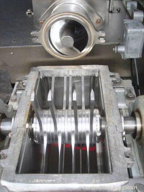 Used Fitzpatrick Fitzmill, Model U, Code DASO6, Stainless Steel. (16) Impact/knife fixed blades. 11" x 13" cutting chamber. Approximate 6" diameter screw feed with hopper, driven by a variable speed ...