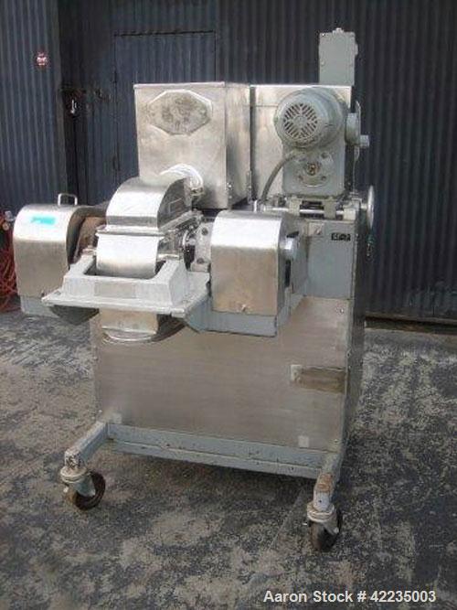 Used Fitzpatrick Fitzmill, Model U, Code DASO6, Stainless Steel. (16) Impact/knife fixed blades. 11" x 13" cutting chamber. Approximate 6" diameter screw feed with hopper, driven by a variable speed ...