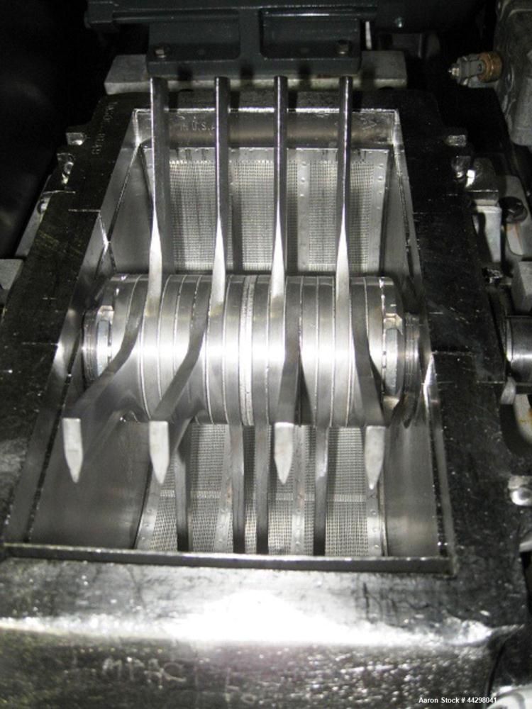 Used Fitzpatrick Fitzmill, Model DASO6. Stainless steel construction, pan feed, on base with motor, serial #8649.
