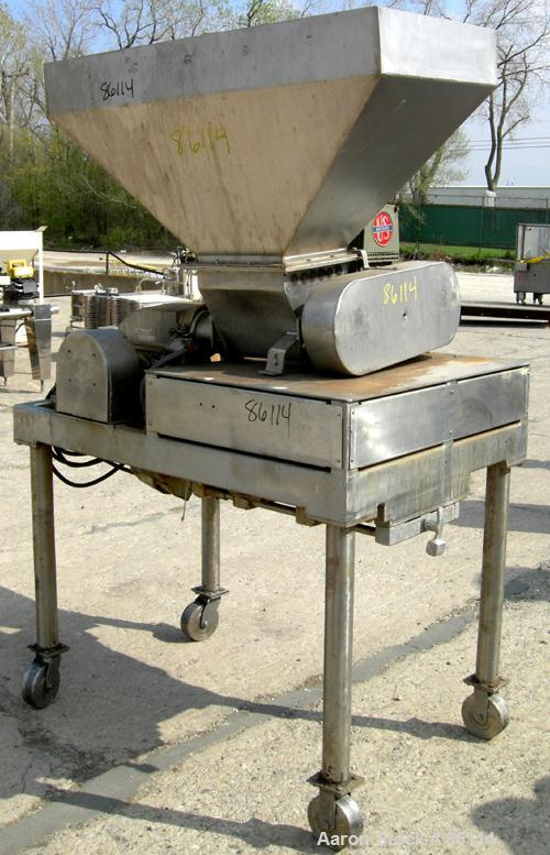 USED: Fitzpatrick Fitzmill, model DASO-6, 304 stainless steel. 16 fixed impact/knife blades, 6" x 11" cutting chamber, 4" diameter feed screw with hopper, driven by an approx 1/4 hp varispeed motor. ...