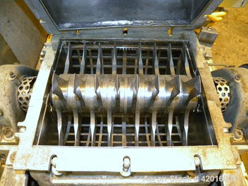 Used Fitzpatrick Fitzmill, model DKAO12, 316 stainless steel. (32) Double knife fixed 410 stainless steel blades, 11" x 13" cutting chamber, 304 stainless steel gravity feed, bottom screen with a 304...