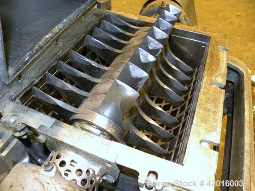 Used Fitzpatrick Fitzmill, model DKAO12, 316 stainless steel. (32) Double knife fixed 410 stainless steel blades, 11" x 13" cutting chamber, 304 stainless steel gravity feed, bottom screen with a 304...