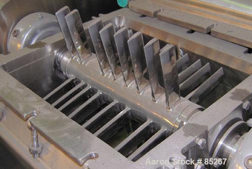 Used Fitzpatrick Fitzmill, Model DKA012, stainless steel. (32) Fixed impact/knife blades. 13" x 11" cutting chamber, gravity feed throat, no bottom screen. Includes a 3/4 hp feed motor, no feed syste...