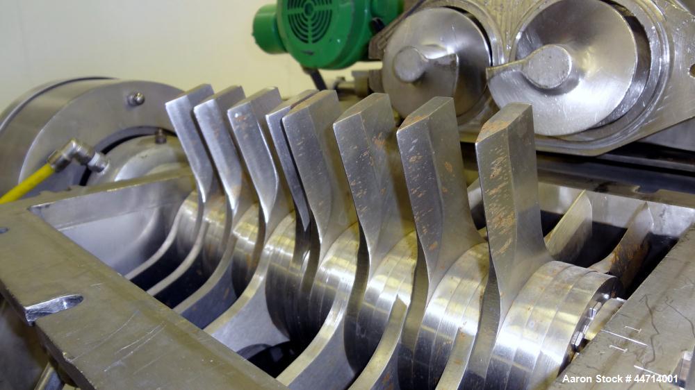 Used Fitzpatrick Fitzmill, Model DKASO12, 316 Stainless Steel. (32) Impact/knife fixed 410 stainless steel blades, 11" x 13" cutting chamber. (2) 4" Diameter x 20" long screw feed with hopper, driven...