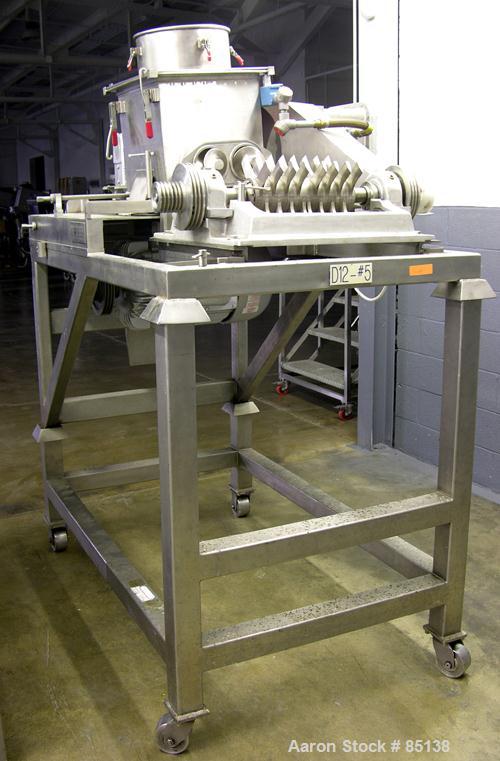 USED: Fitzmill model DKASO-12, stainless steel construction. Fixed knives, twin screw feed with 1 hp, 230/460 volt XP drive, 10/15 hp, 190/380/230/460 XP main drive. Missing feed throat. Mounted on l...