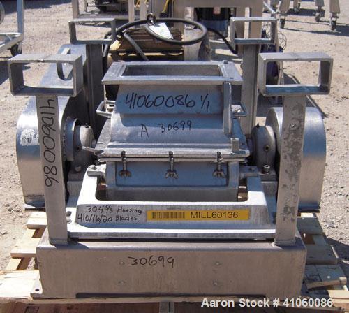 Used Fitzpatrick Fitzmill, Model DKASO12, 304 stainless steel. (32) impact/knife fixed 410 stainless steel blades, 11" x 13" cutting chamber, gravity feed hopper, no bottom screen. Driven by an appro...