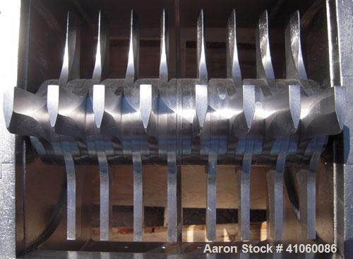 Used Fitzpatrick Fitzmill, Model DKASO12, 304 stainless steel. (32) impact/knife fixed 410 stainless steel blades, 11" x 13" cutting chamber, gravity feed hopper, no bottom screen. Driven by an appro...