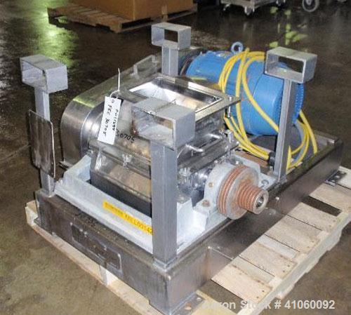 Used Fitzpatrick Fitzmill, Model DKASO12, stainless steel construction, (32) knife/impact fixed knives, reversible chamber, gravity feed, 15 hp motor, belt driven. Mounted on a stainless steel base, ...