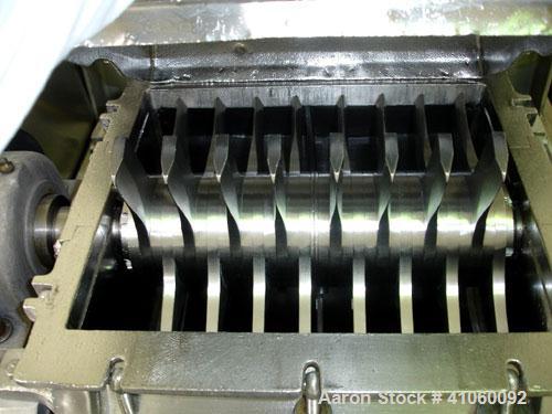 Used Fitzpatrick Fitzmill, Model DKASO12, stainless steel construction, (32) knife/impact fixed knives, reversible chamber, gravity feed, 15 hp motor, belt driven. Mounted on a stainless steel base, ...