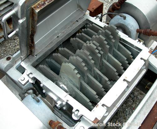 USED: Fitzpatrick Fitzmill, model DKASO12, 304 stainless steel. (32) fixed double impact blades, 11" x 13" cutting chamber, no bottom screen. Forced fed feed throat with a 4" tri clamp opening, water...
