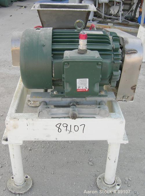 USED: Fitzpatrick Fitzmill, model DKASO12, 316 stainless steel. (32) 410 stainless steel fixed impact blades. 13" x 11" cutting chamber with gravity feed throat and bottom screen. Water cooled bearin...