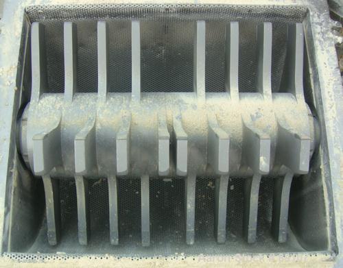 USED: Fitzpatrick Fitzmill, model DKASO12, 316 stainless steel. (32) 410 stainless steel fixed impact blades. 13" x 11" cutting chamber with gravity feed throat and bottom screen. Water cooled bearin...