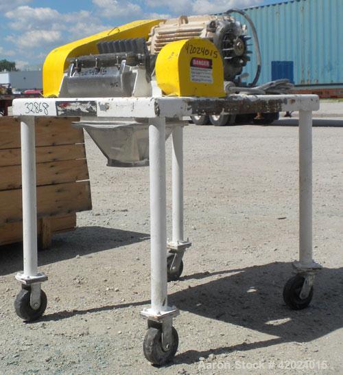Used Fitzpatrick Fitzmill, Model DKSO12, 316 Stainless Steel. (32) Knife/impact fixed 410/16/20 stainless steel blades, 11" x 13" cutting chamber, bottom screen, missing feed throat. Water cooled bea...