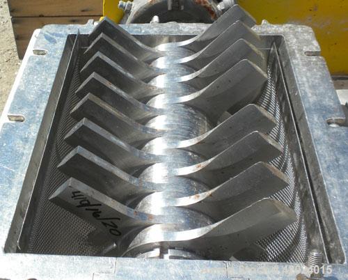 Used Fitzpatrick Fitzmill, Model DKSO12, 316 Stainless Steel. (32) Knife/impact fixed 410/16/20 stainless steel blades, 11" x 13" cutting chamber, bottom screen, missing feed throat. Water cooled bea...