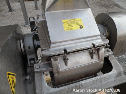 Used Fitzpatrick Fitzmill, Model FASO12, 316 Stainless Steel. (24) Double knife fixed 410 stainless steel blades, 11" x 13" cutting chamber, gravity feed hopper, bottom screen with a  discharge chute...