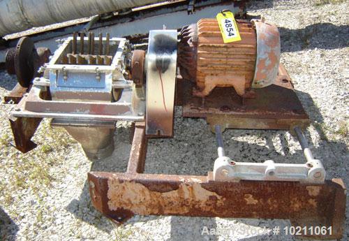 Used Fitzmill Comminuter Hammermill,  Model Code FASO12. Stainless steel construction. Unit is missing cover on mill. Mill does freely rotate but needs to be rebuilt. Existing motor is 20 hp, 3510 rp...
