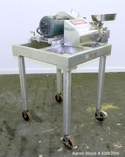 Used Fitzpatrick Homoloid Mill, Model JT, 316 Stainless Steel. 7-1/2'' Diameter x 2'' deep chamber, (12) 410/16/20 stainless steel swinging impact/knife blades. Bottom screen. Top 304 stainless steel...