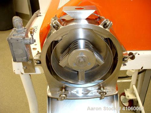Used Fitzpatrick Homoloid Fitzmill, Model JT, stainless steel construction, gravity feed with hopper, swinging hammers on base with 
approximately 3 hp motor, serial #1294.