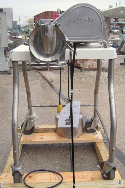 Used Fitzpatrick Homoloid Mill, Model JT, 304 stainless steel. 8'' diameter x 2'' deep chamber, (12) 410 stainless steel swinging double impact blades, bottom screen. Top feed, no pan. Driven by a 5 ...