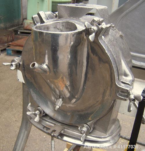 Used Fitzpatrick Homoloid Mill, Model JT, 304 stainless steel. 8'' diameter x 2'' deep chamber, (12) 410 stainless steel swinging double impact blades, bottom screen. Top feed, no pan. Driven by a 5 ...