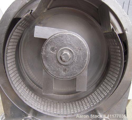 Used Fitzpatrick Homoloid Mill, Model JT, 304 stainless steel. 8'' diameter x 2'' deep chamber, (12) 410 stainless steel swinging double impact blades, bottom screen. Top feed, no pan. Driven by a 5 ...