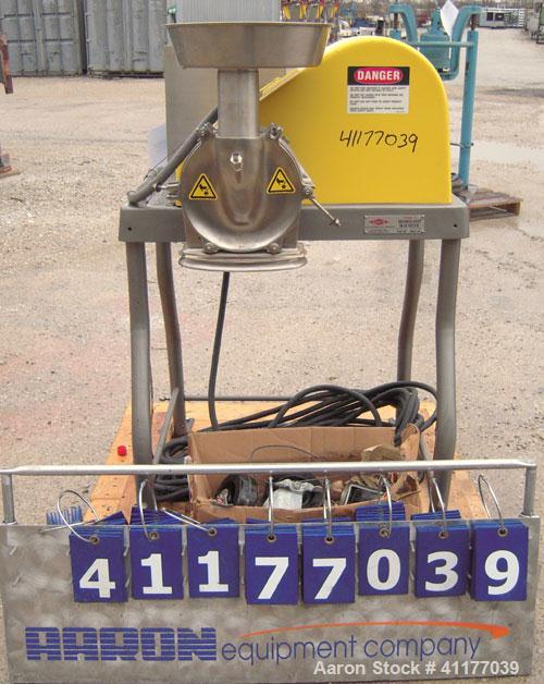 Used Fitzpatrick Homoloid Mill, Model JT, 316 stainless steel. 8'' diameter x 2'' deep chamber, (12) 410 stainless steel swinging impact/knife blades, no bottom screen. Top feed with pan. Driven by a...