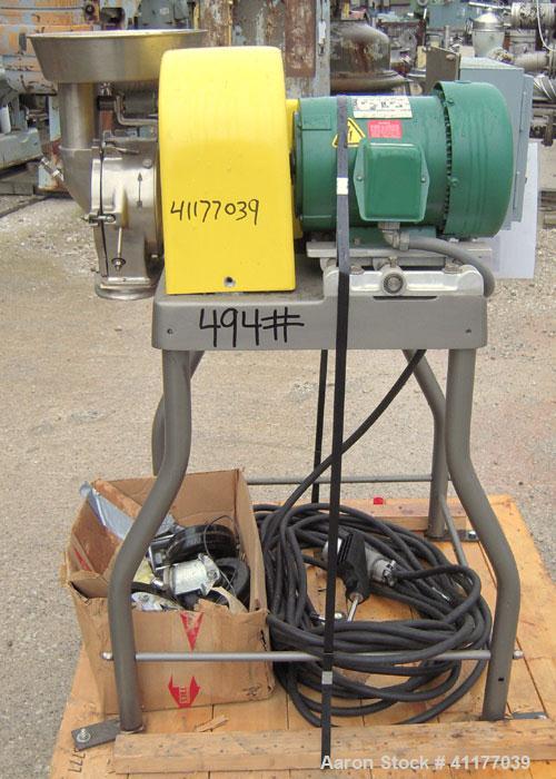 Used Fitzpatrick Homoloid Mill, Model JT, 316 stainless steel. 8'' diameter x 2'' deep chamber, (12) 410 stainless steel swinging impact/knife blades, no bottom screen. Top feed with pan. Driven by a...