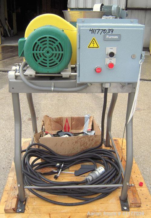 Used Fitzpatrick Homoloid Mill, Model JT, 316 stainless steel. 8'' diameter x 2'' deep chamber, (12) 410 stainless steel swinging impact/knife blades, no bottom screen. Top feed with pan. Driven by a...