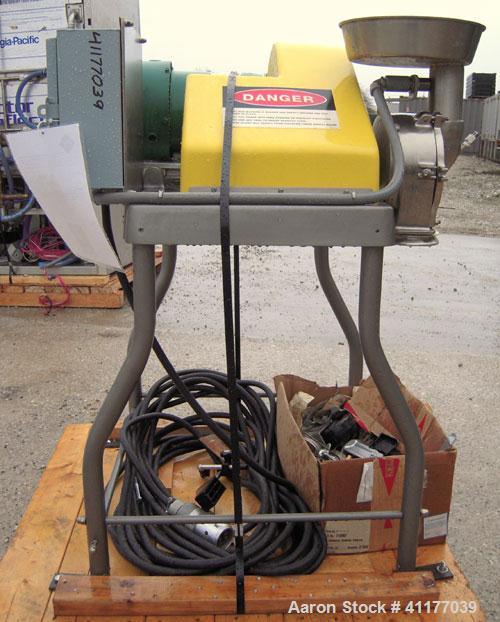 Used Fitzpatrick Homoloid Mill, Model JT, 316 stainless steel. 8'' diameter x 2'' deep chamber, (12) 410 stainless steel swinging impact/knife blades, no bottom screen. Top feed with pan. Driven by a...