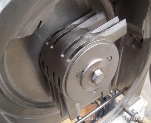 Used Fitzpatrick Homoloid Mill, Model JT, 316 stainless steel. 8'' diameter x 2'' deep chamber, (12) 410 stainless steel swinging impact/knife blades, no bottom screen. Top feed with pan. Driven by a...