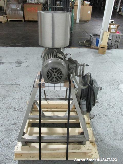 Used Fitzpatrick Homoloid Mill, Model J. Stainless steel product contact surfaces, fixed knives, gravity feed, on stand with direct coupled 3hp, 230/460 volt XP motor. Serial# J-1034.