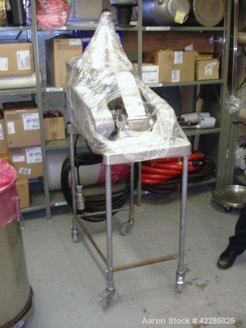 Used Fitzpatrick Fitzmill, Model M5, 316 Stainless Steel. Swinging blades. 4-1/2" x 8-3/4" cutting chamber. Gravity feed throat with pan. Driven by a 3hp, 550 volt motor. Mounted on a base. Serial# 1...