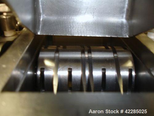 Used Fitzpatrick Fitzmill, Model M5, 316 Stainless Steel. Swinging blades. 4-1/2" x 8-3/4" cutting chamber. Gravity feed throat with pan. Driven by a 3hp, 550 volt motor. Mounted on a base. Serial# 1...