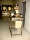 Used Fitzmill, Model D6, stainless steel construction, swinging hammers, reversible chamber, pan feed with 5 hp motor on stands.