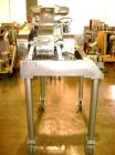 Used Fitzpatrick Fitzmill, Model D6, Stainless Steel. (16) Knife/impact swinging blades, reversible chamber, pan feed with 5 hp 220/440 volt motor on stands.
