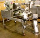 Used Fitzpatrick Fitzmill, Model DKASO-12, Stainless Steel. Twin screw feed wtih 1 hp, 230/460 volt XP drive, less rotor, cover, bearings, guard, ends and seals. Approximately 20 hp main drive.