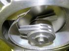 Used Fitzpatrick Homoloid Mill, Model JT, 316 Stainless Steel. 7-1/2'' Diameter x 2'' deep chamber, (12) 410/16/20 stainless steel swinging impact/knife blades. Bottom screen. Top 304 stainless steel...