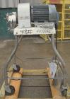 Used Fitzpatrick Homoloid Mill, Model JT, 304 stainless steel. 8'' diameter x 2'' deep chamber, (12) 410 stainless steel swinging double impact blades, bottom screen. Top feed, no pan. Driven by a 5 ...