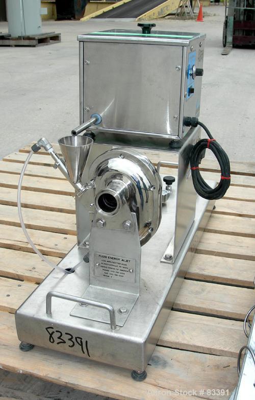 USED: Fluid Energy Aljet mill, 316 stainless steel. Top feed with hopper. 2" tri-clamp outlet. Includes an Accurate feeder with hopper. Mounted on a stainless steel base.